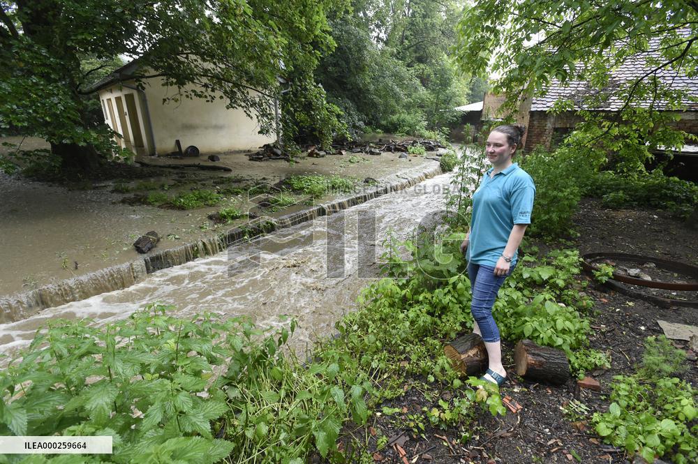 firefighters evacuated the old people's home in Hermanuv Mestec after a nearby pond dam overflowed amid torrential rains