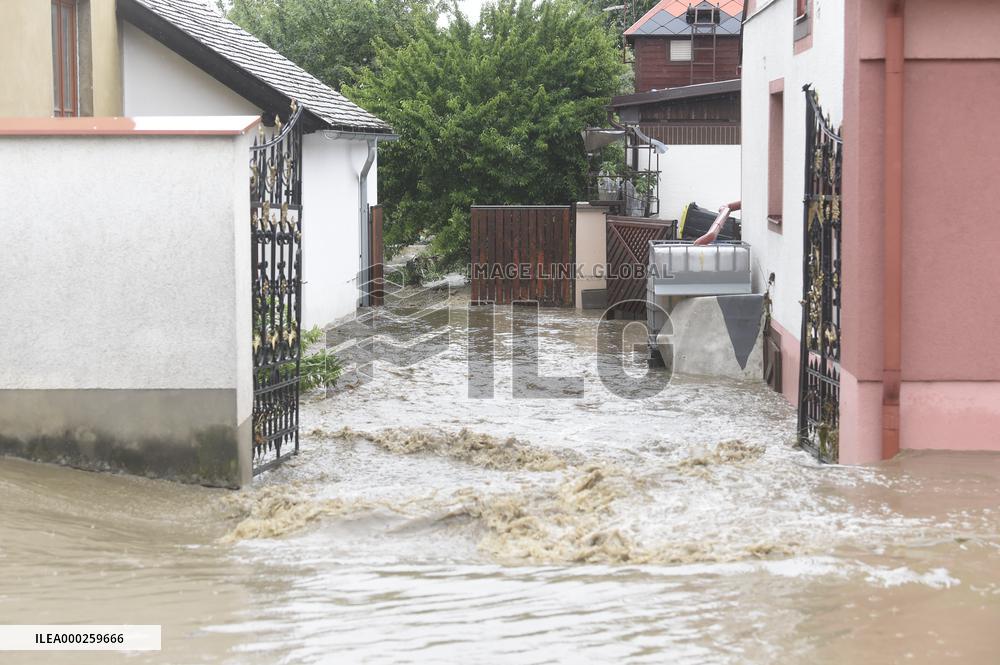 firefighters evacuated the old people's home in Hermanuv Mestec after a nearby pond dam overflowed amid torrential rains