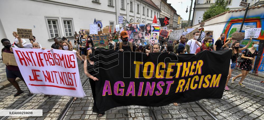 people in Prague protest against police, racial violence, Black Lives Matter, banner together against racism