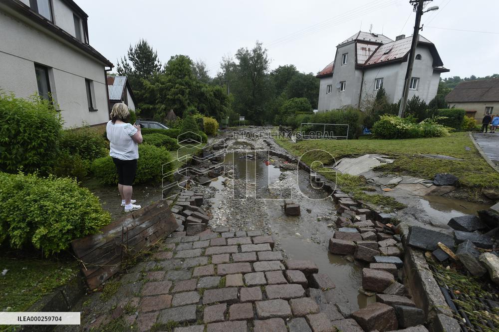 flood damage after torrential rains in Vapenny Podol Village