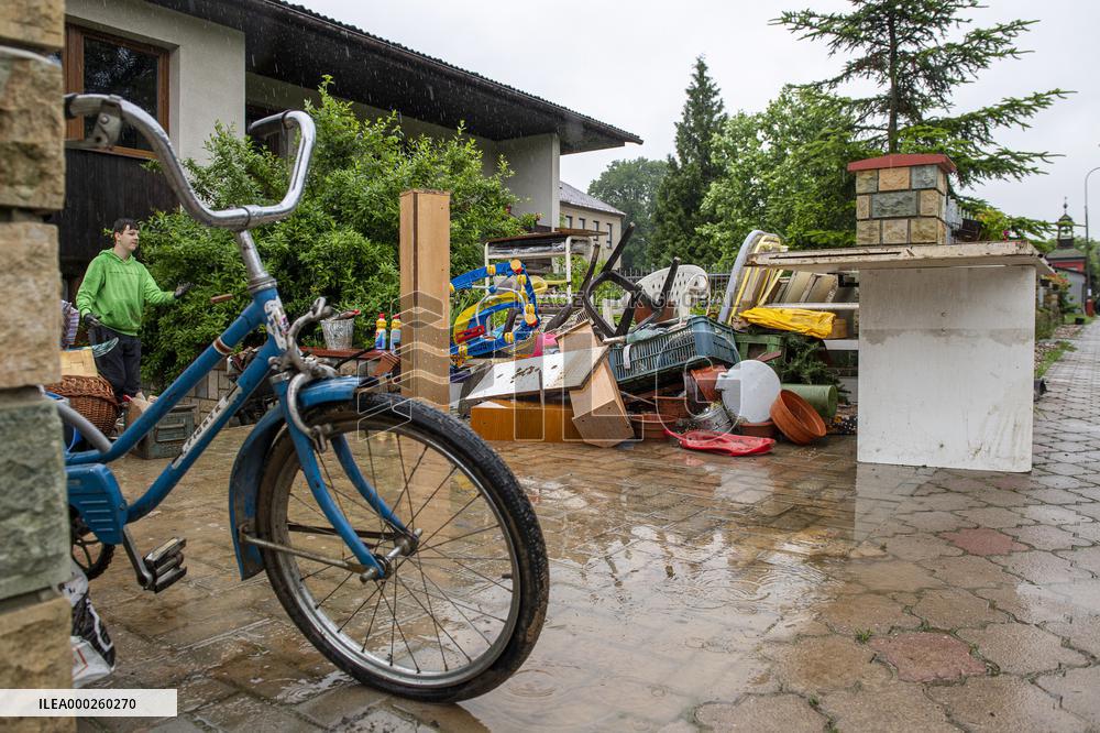 people removing damage of local flood