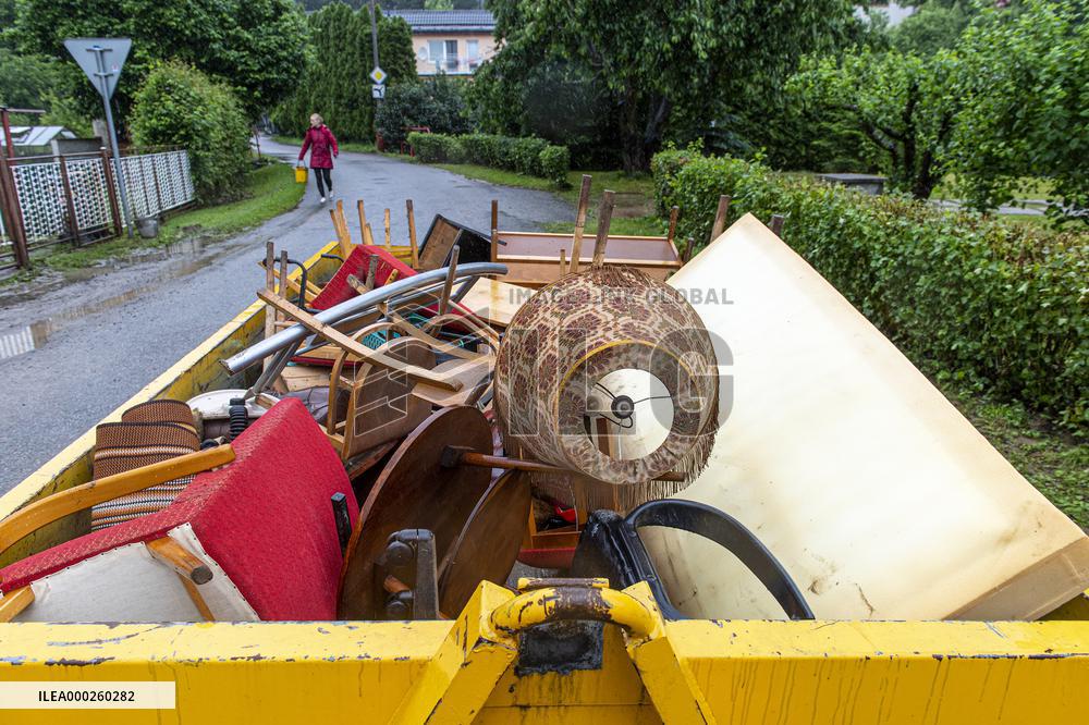 people removing damage of local flood