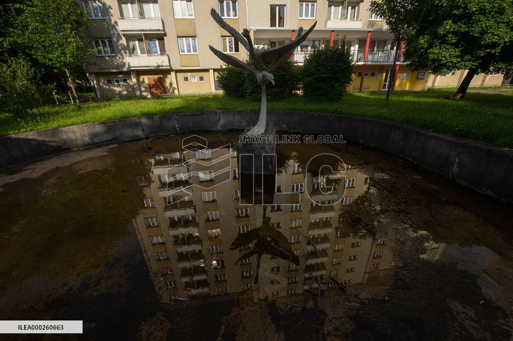 oldest panel building built in Budweis is reflected in a fountain