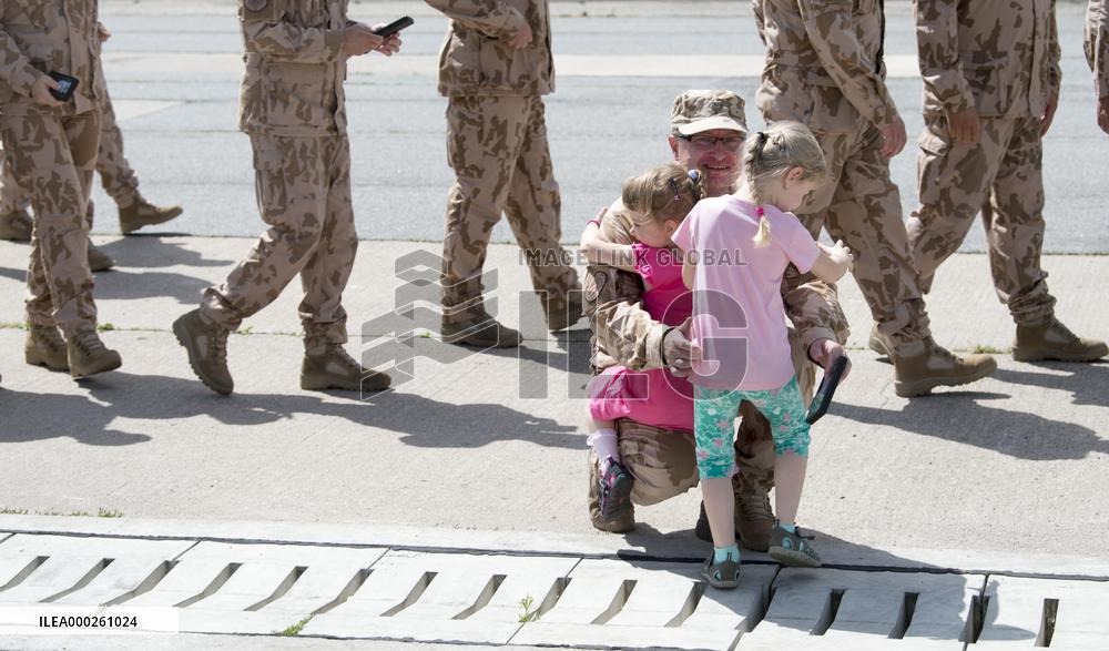 Parade of Czech military's 20th task group, soldiers, father, child