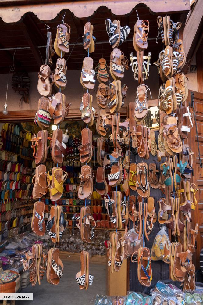 sell of souvenirs, cookware, products from letaher and wood  in medina