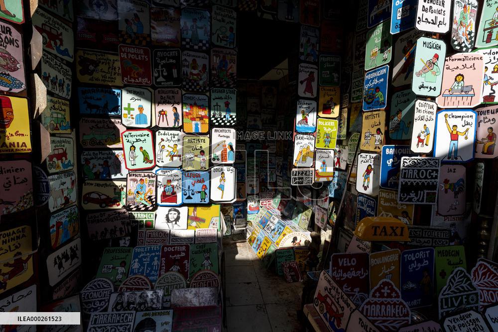 sell of souvenirs, cookware, products from letaher and wood  in medina