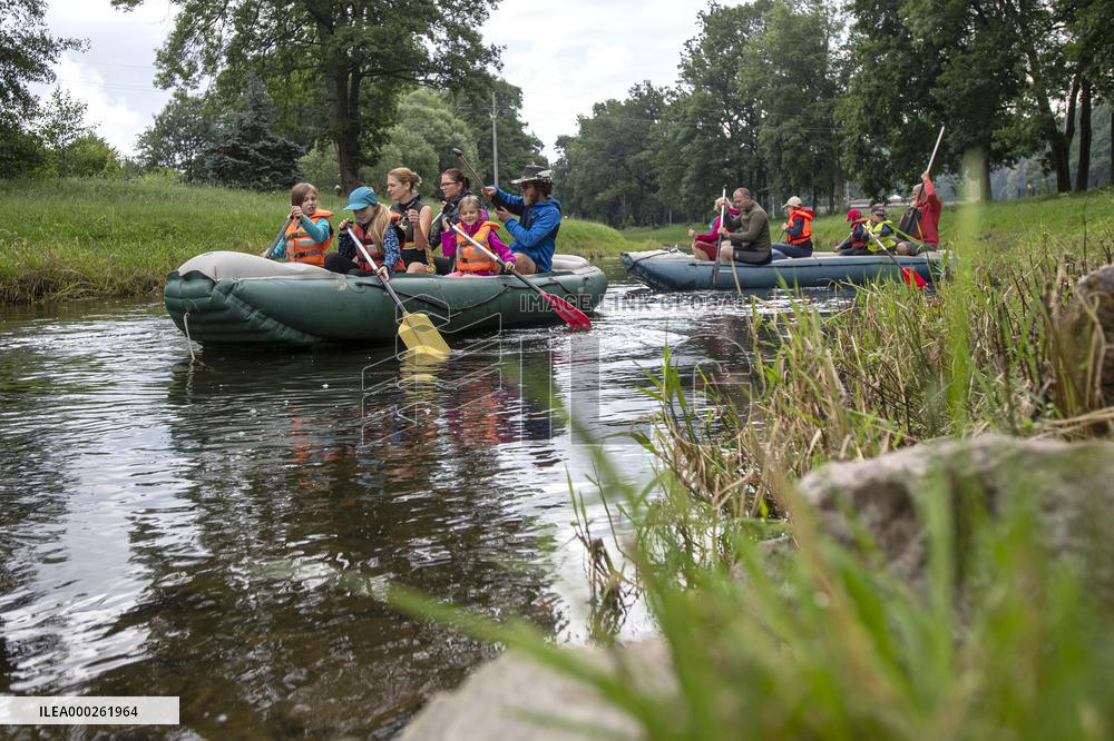 water tourists in a boat on the Orlice river, boats