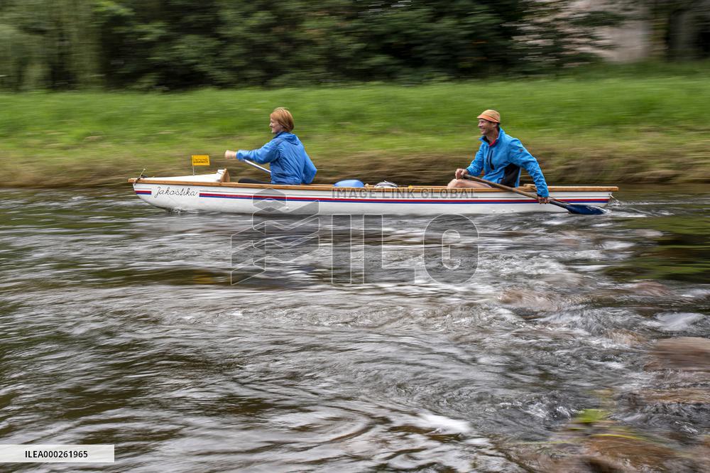 water tourists in a boat on the Orlice river