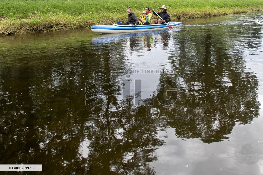 water tourists in a boat on the Orlice river