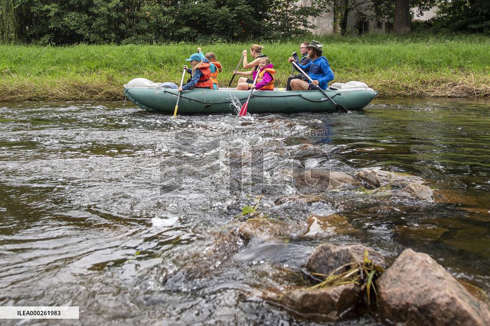 water tourists in a boat on the Orlice river