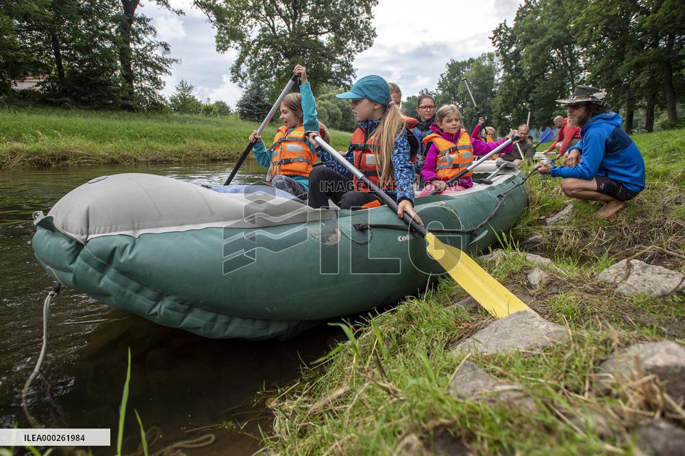 water tourists in a boat on the Orlice river, children