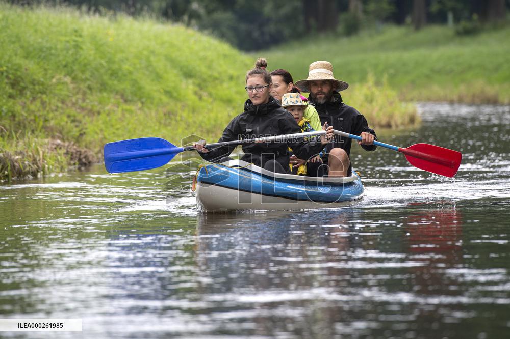water tourists in a boat on the Orlice river