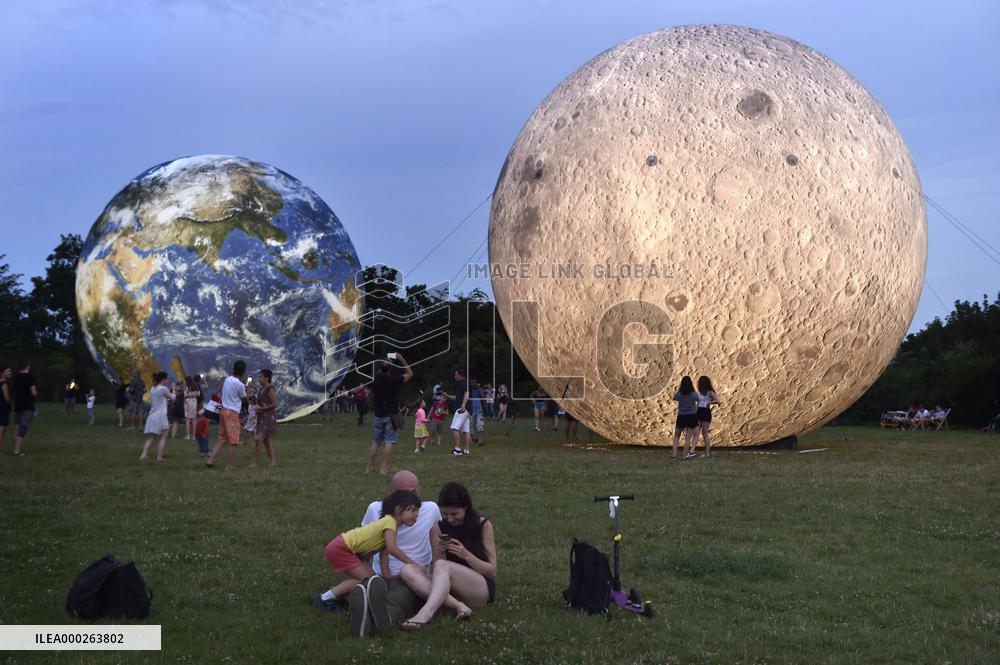giant inflatable model of the Moon and the planet Earth