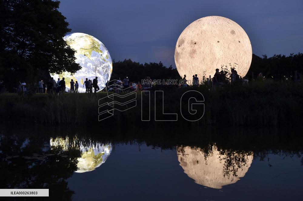 giant inflatable model of the Moon and the planet Earth