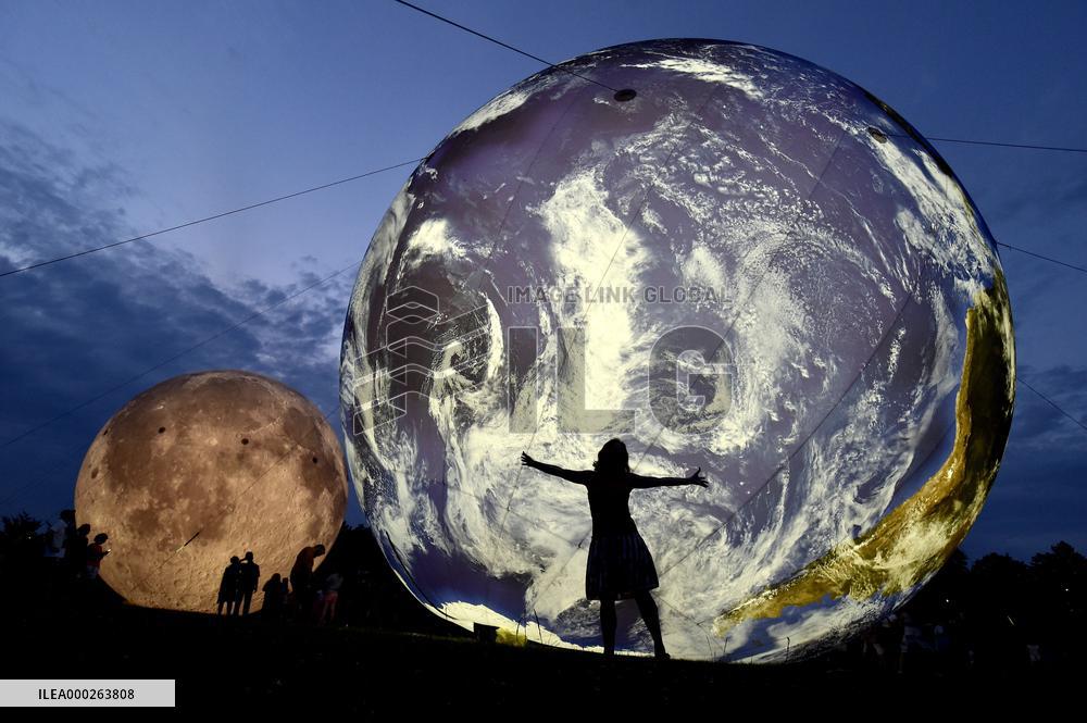 giant inflatable model of the Moon and the planet Earth
