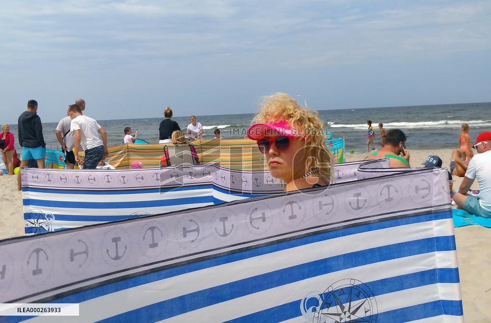 Stylish lady on the beach in the Katy Rybackie village at the Baltic sea coast