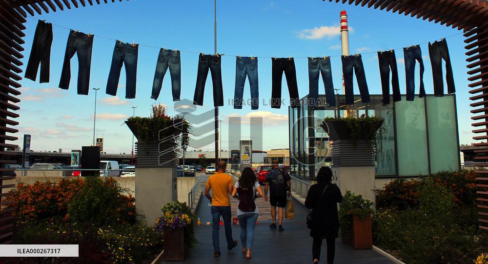 Jeans (blue)  hanging on a rope, clothes pins pegs