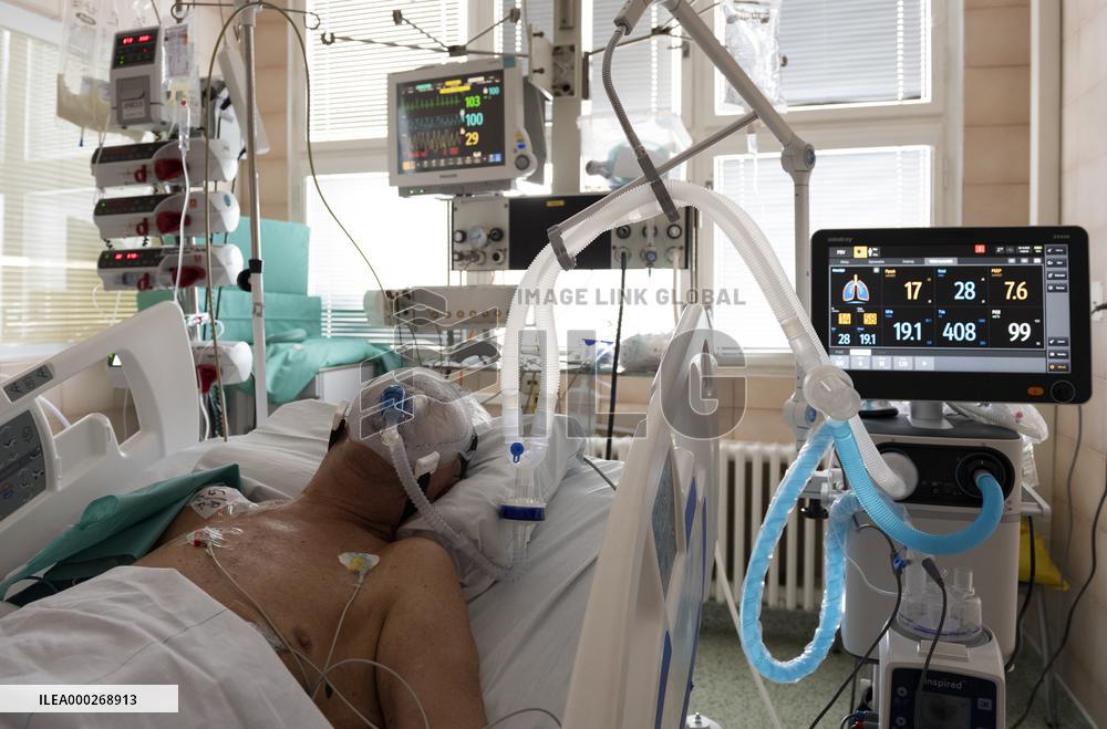 A medic nurses a patient at Intensive Care Unit