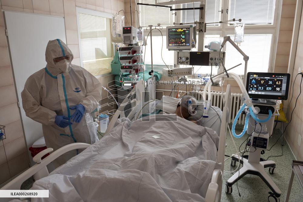 A medic nurses a patient at Intensive Care Unit