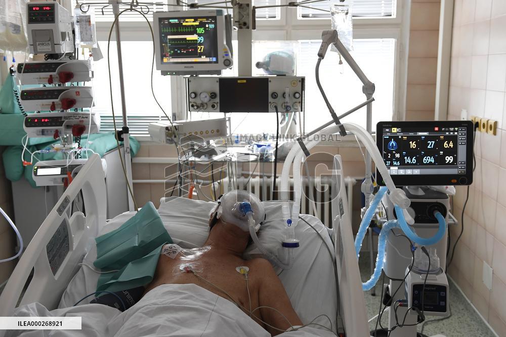 A medic nurses a patient at Intensive Care Unit