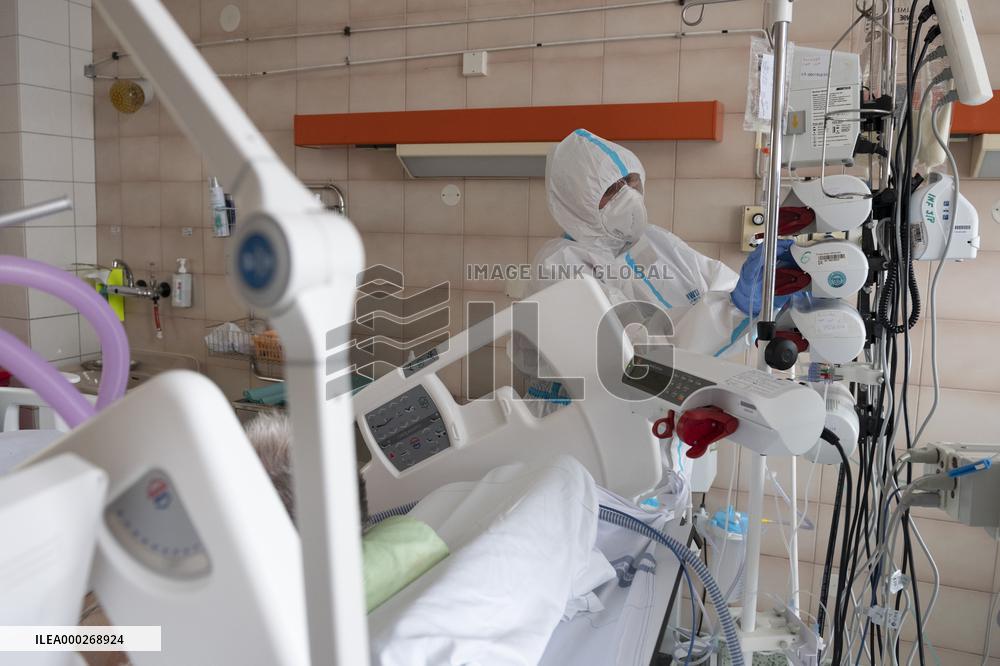 A medic nurses a patient at Intensive Care Unit