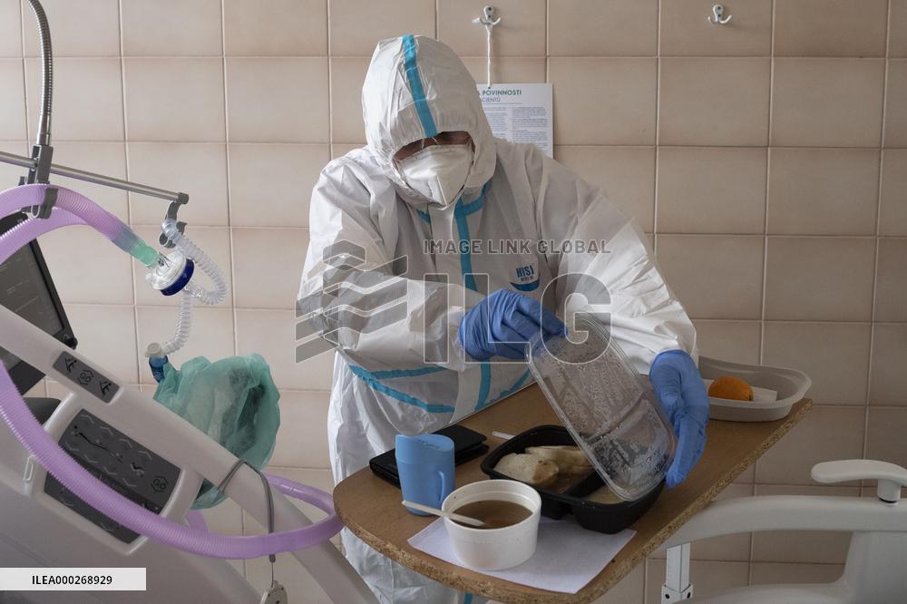 A medic nurses a patient at Intensive Care Unit