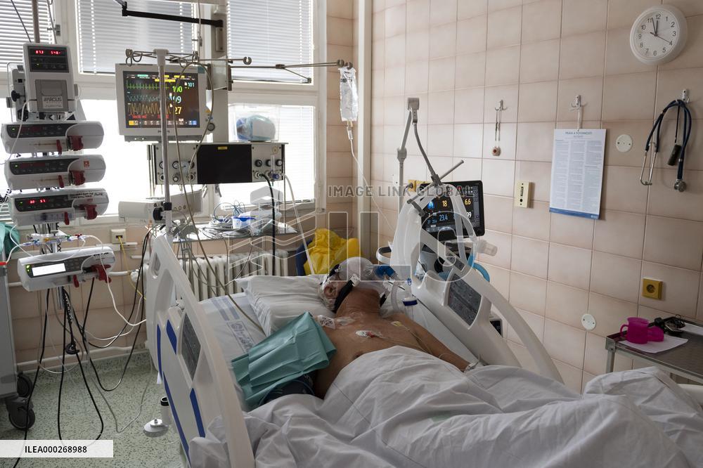 A medic nurses a patient at Intensive Care Unit