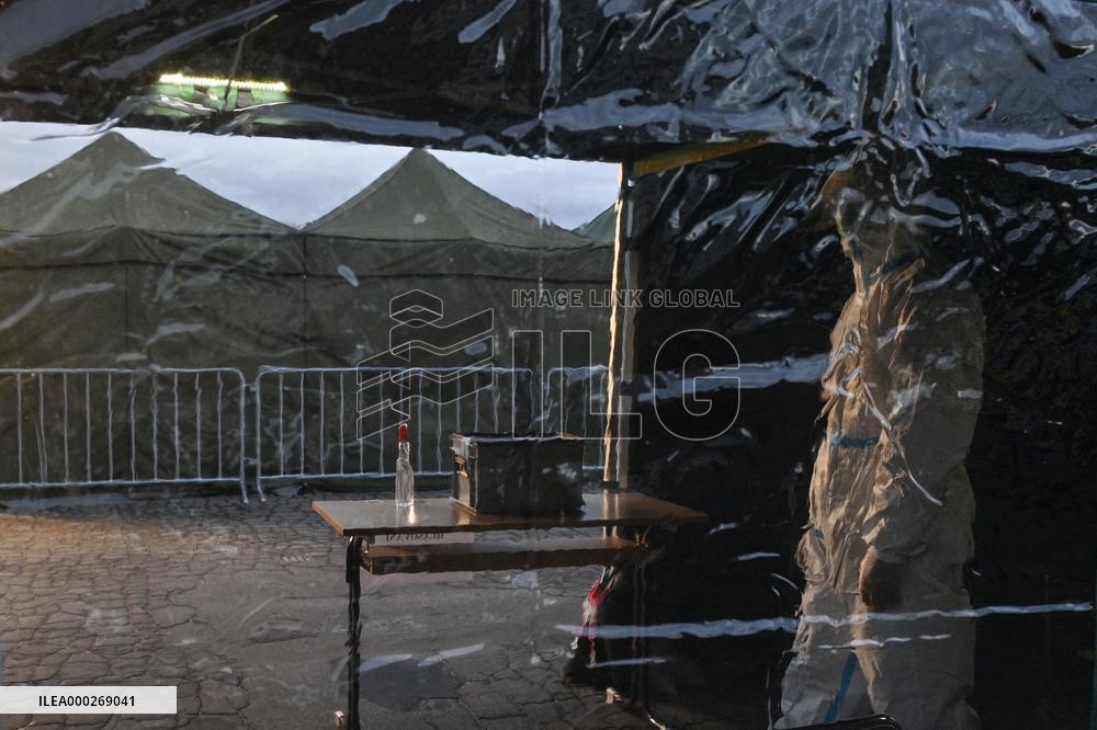 drive-in point, polling place, Senate elections, second round, election commission in protective clothing, suit, tent