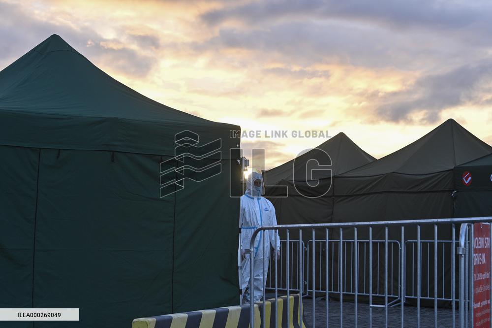 drive-in point, polling place, Senate elections, second round, election commission in protective clothing, suit, tent