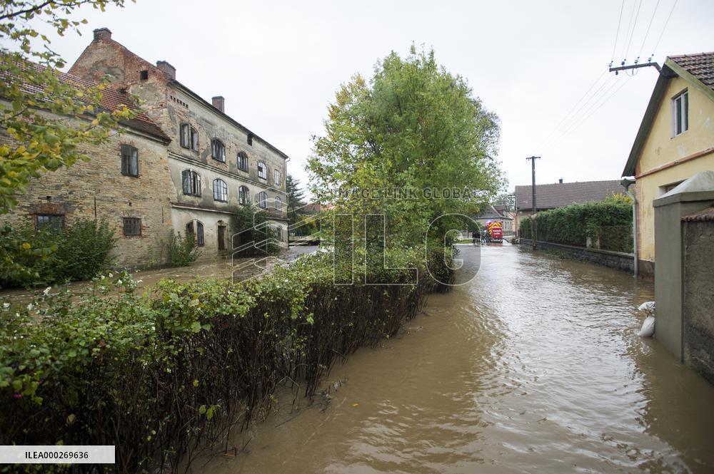 River Novohradka, village Luze, heavy rain, raised water level