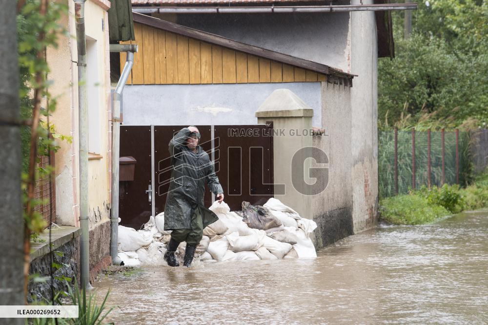 River Novohradka, village Luze, heavy rain, raised water level