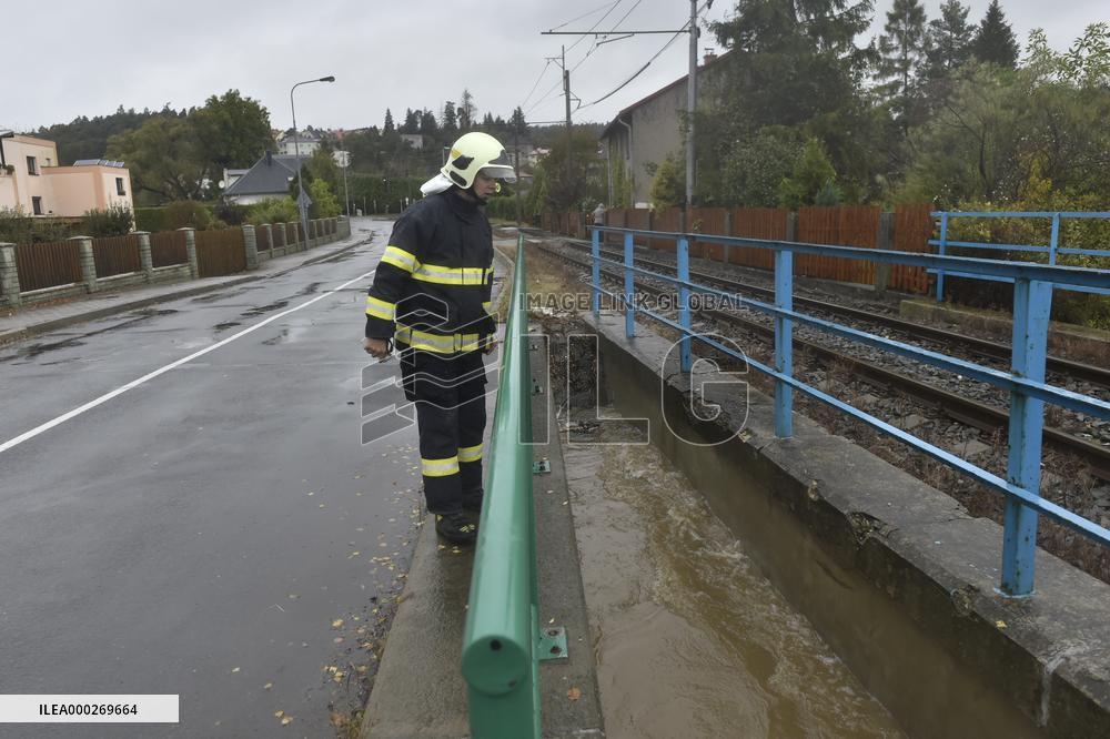River Porubka, village Vresina, heavy rain, raised water level, fireman