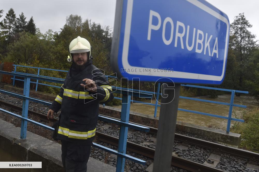 River Porubka, village Vresina, heavy rain, raised water level, fireman