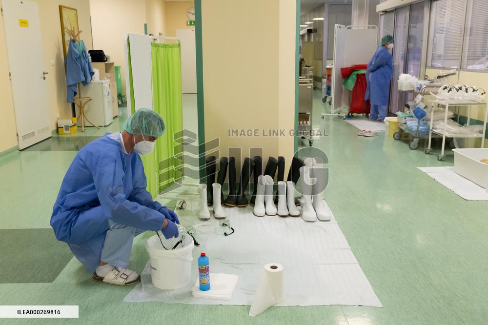 intensive care unit (ICU) for patients with COVID-19 disease, hospital, medical staff, protective clothing, suit, shoes, footwear, disinfection