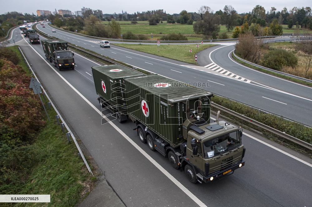 Military convoy with equipment for field hospital, container