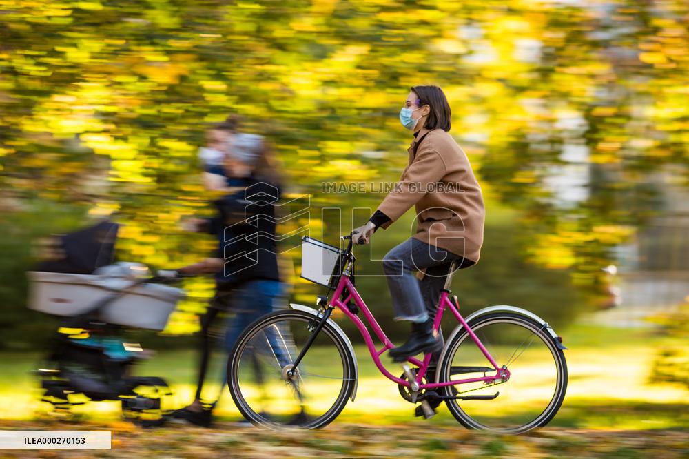 Women, mother, pram, autumn, colours, take care, leaf, yellow, smile, good mood, cyclist, face mask