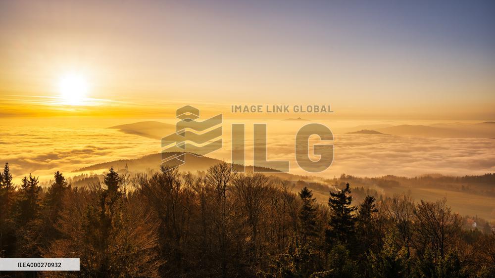 Temperature inversion, Czech landscape, Korenov, view from observation tower Stepanka, sun set, autumn