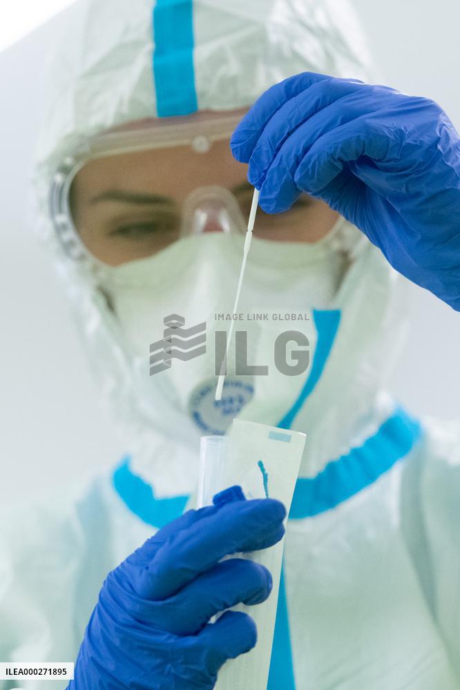 mass testing of children for COVID-19 disease in kindergarten, test, tests, protective clothing, suit, sample