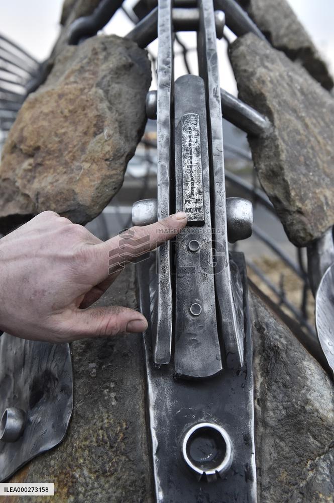A five-metre stone and stainless steel statue of a carp, fish