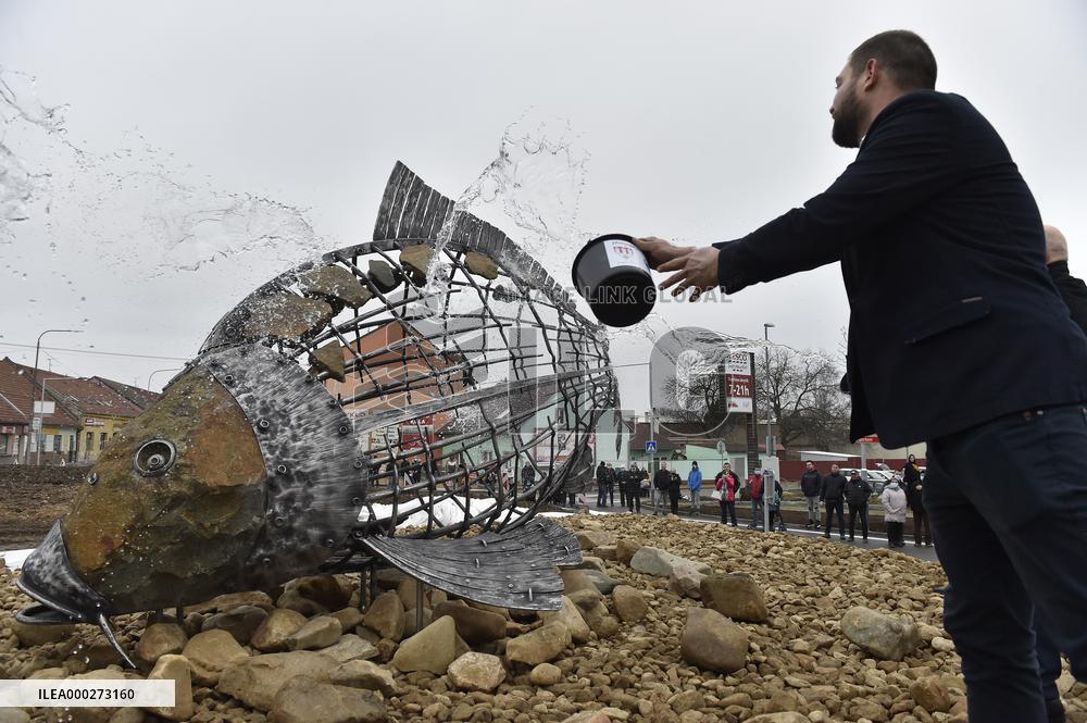 A five-metre stone and stainless steel statue of a carp, fish