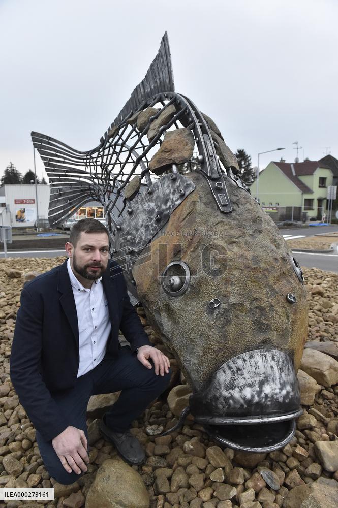 A five-metre stone and stainless steel statue of a carp, fish