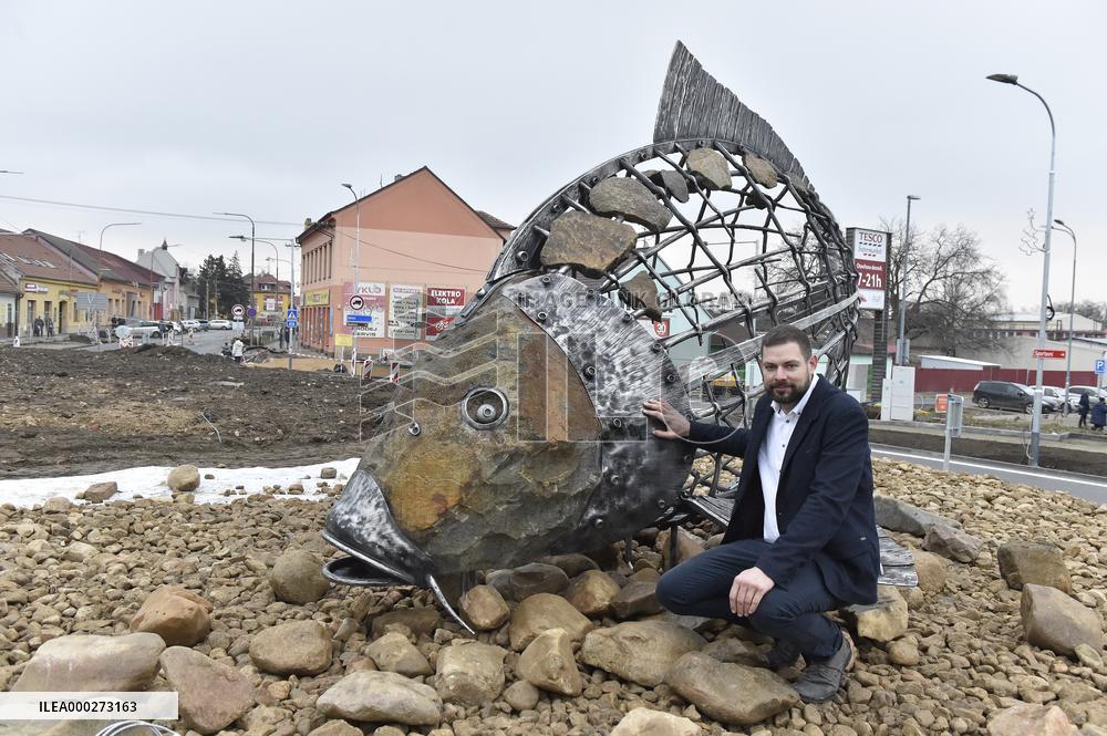 A five-metre stone and stainless steel statue of a carp, fish