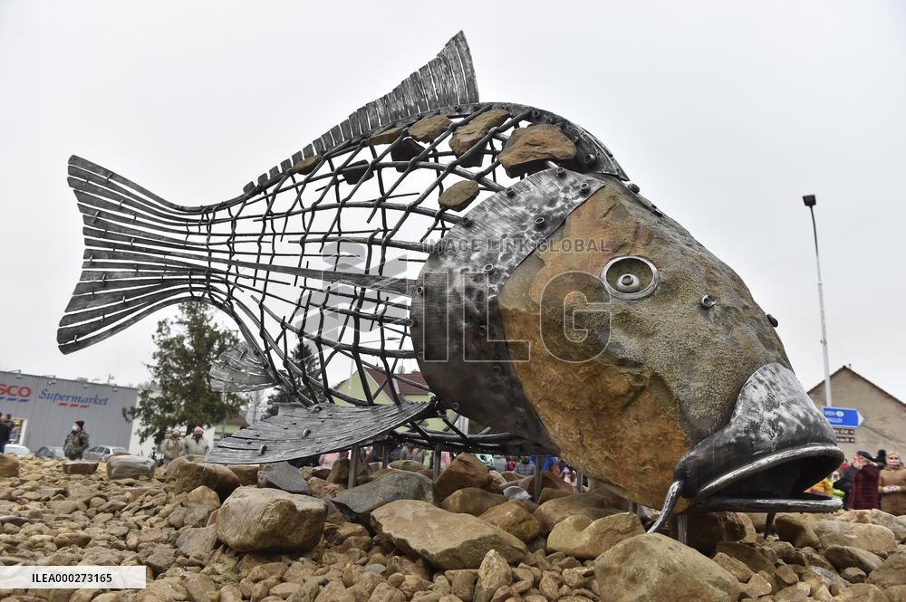 A five-metre stone and stainless steel statue of a carp, fish