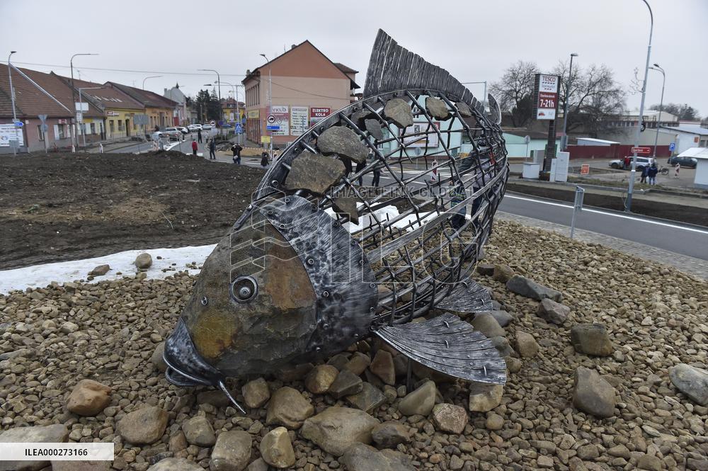 A five-metre stone and stainless steel statue of a carp, fish