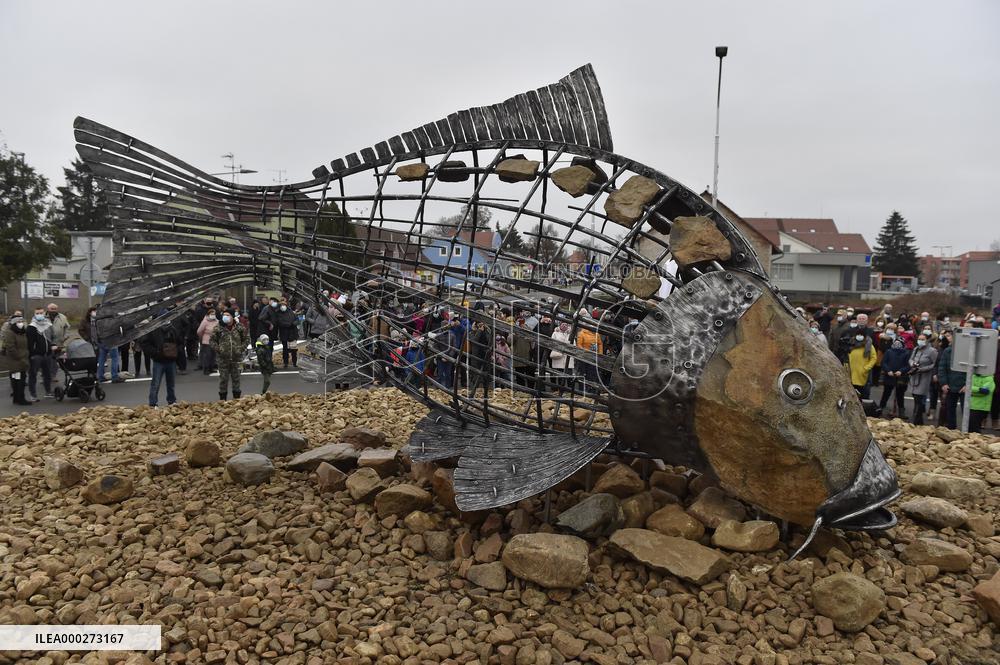 A five-metre stone and stainless steel statue of a carp, fish