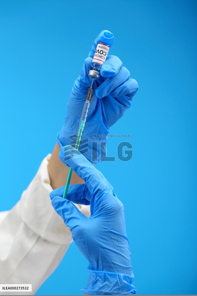Vaccine, vaccination, covid-19, coronavirus, vaccine syringe, injection, application, gloves, mask, protective clothing