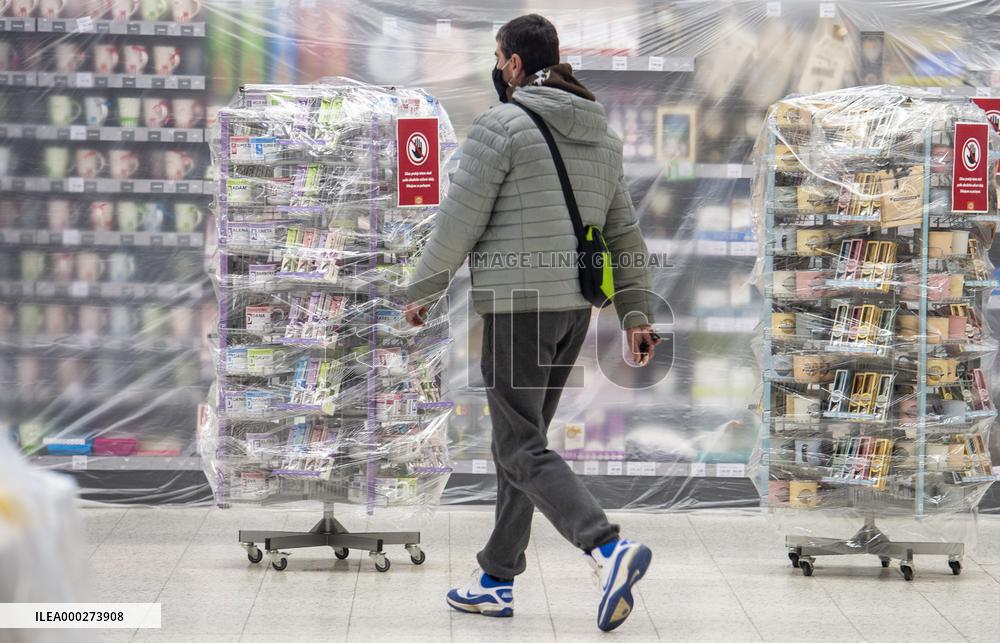 coronavirus restrictions leaflet in Hypermarket Globus