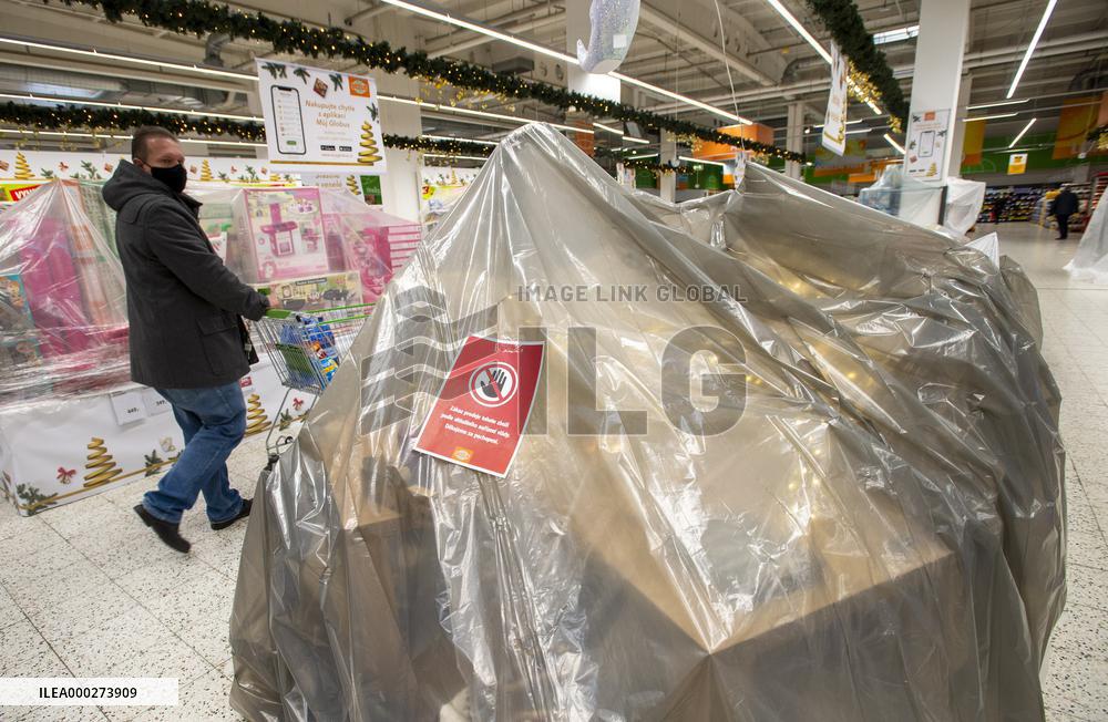 coronavirus restrictions leaflet in Hypermarket Globus