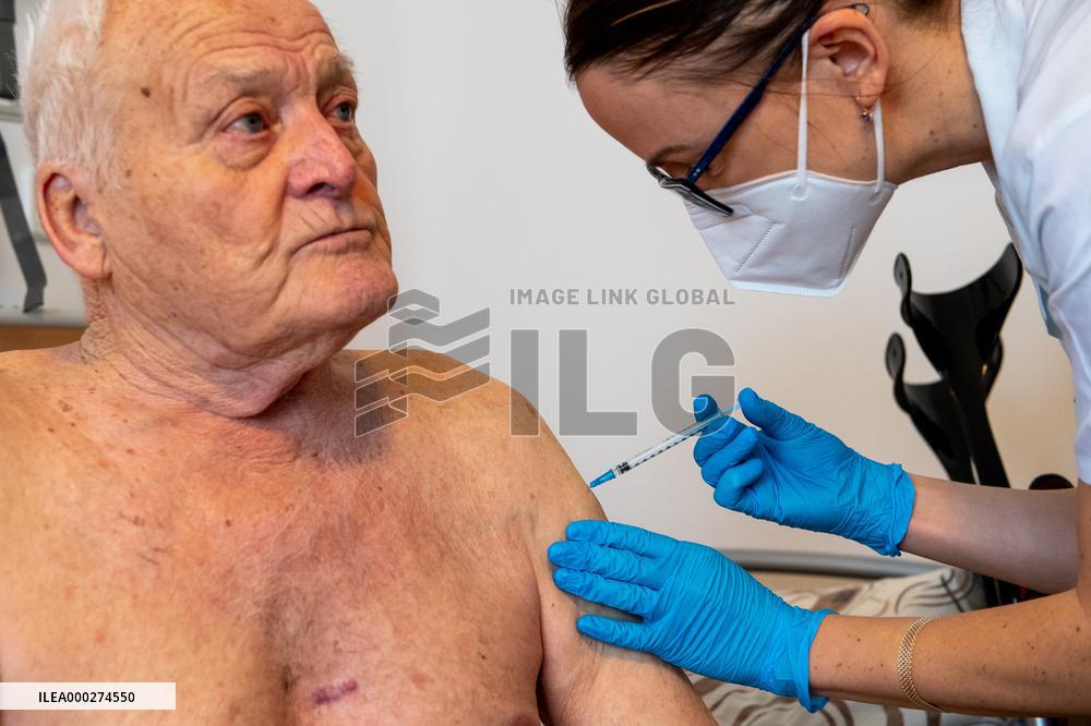 Vaccination against coronavirus, Czech Republic, syringe, senior