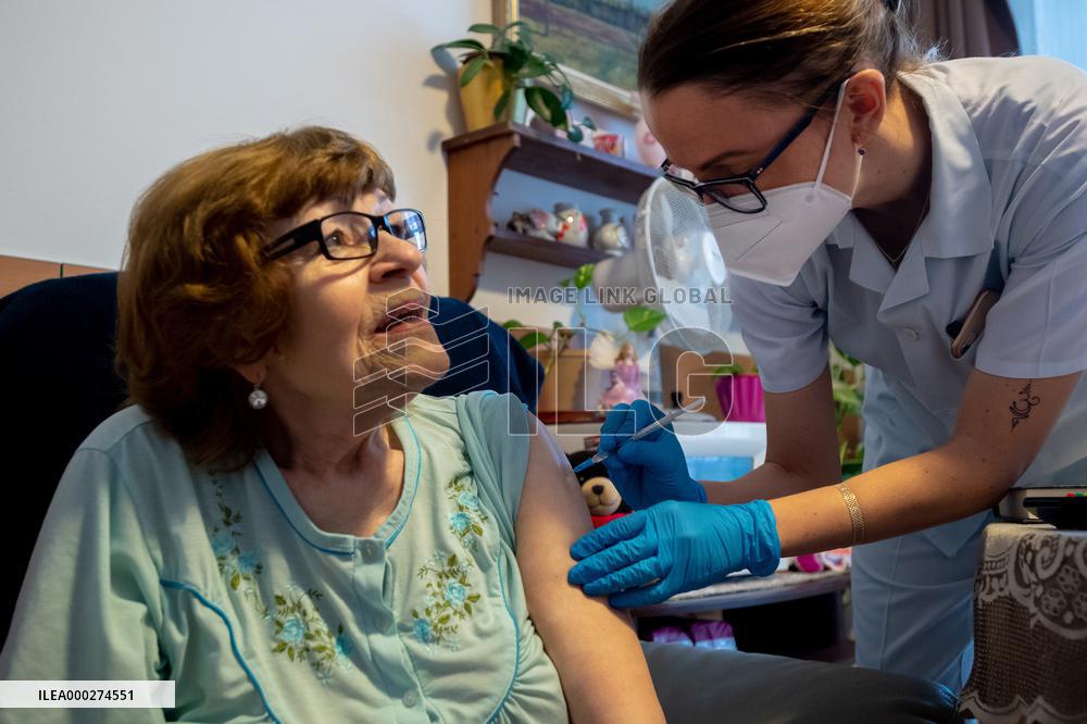 Vaccination against coronavirus, Czech Republic, syringe, senior
